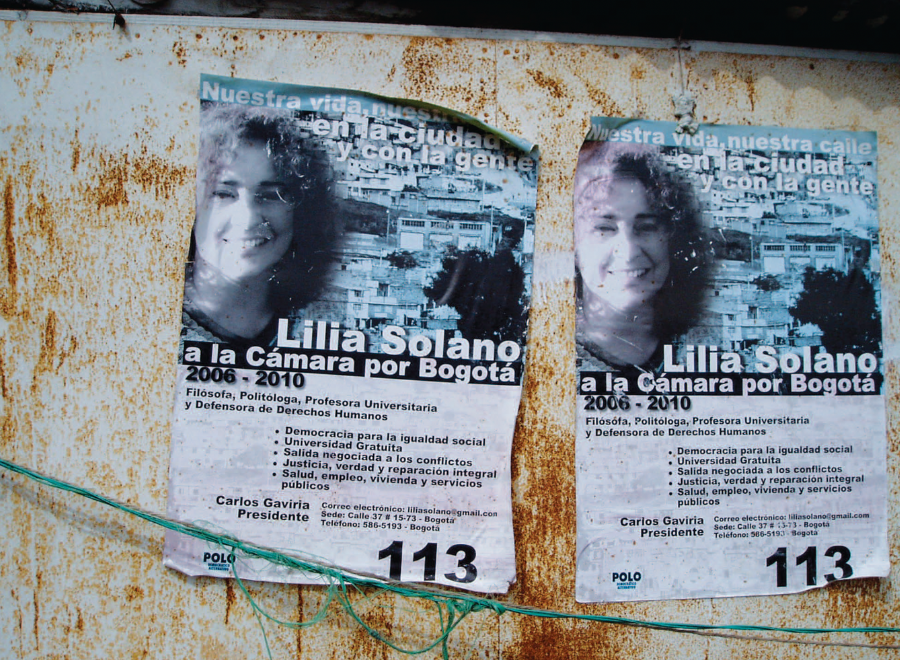 Photograph of tattered posters on wall