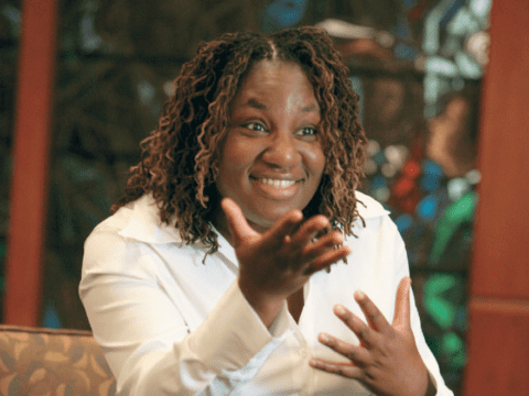 Young Black woman in white blouse