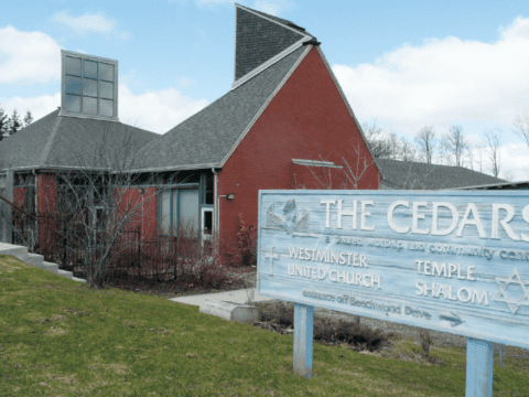 Red building that is United Church and Jewish temple