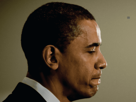 Black man in suit and tie in profile
