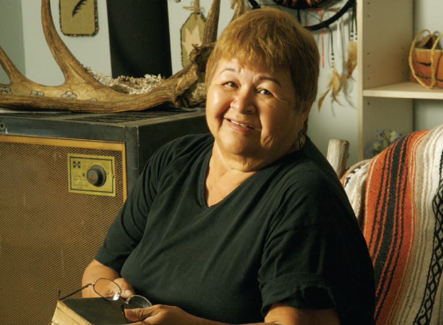 Indigenous woman holding old Bible