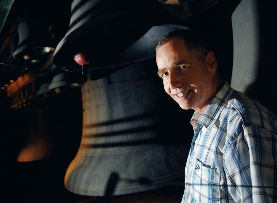 Young white man in front of carillon bells