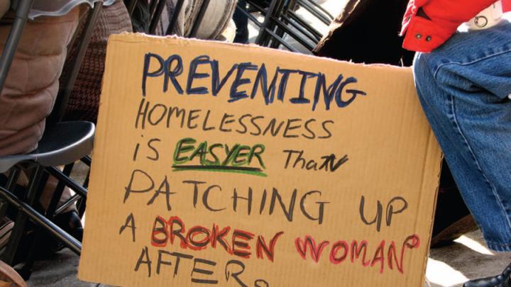 Cardboard sign about preventing homelessness