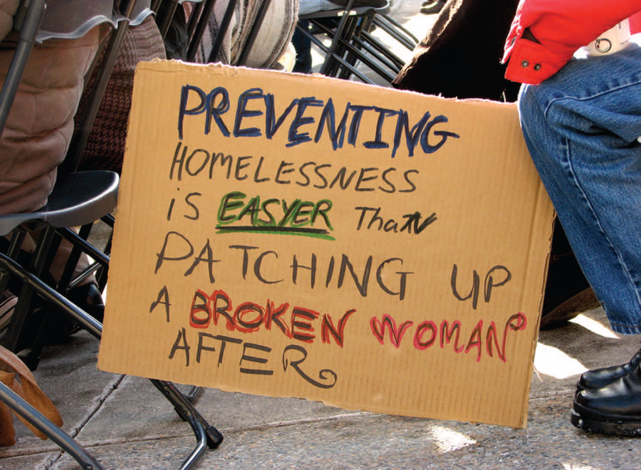 Cardboard sign about preventing homelessness