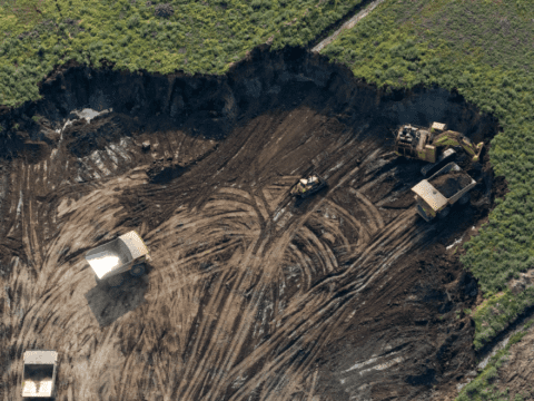 Overhead shot of mining operation cut out of landscape
