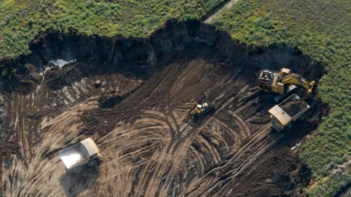 Overhead shot of mining operation cut out of landscape