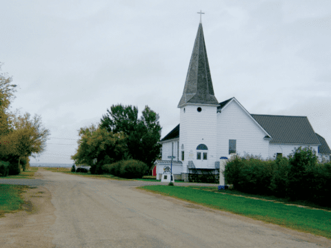 White clapboard church in rural prairie