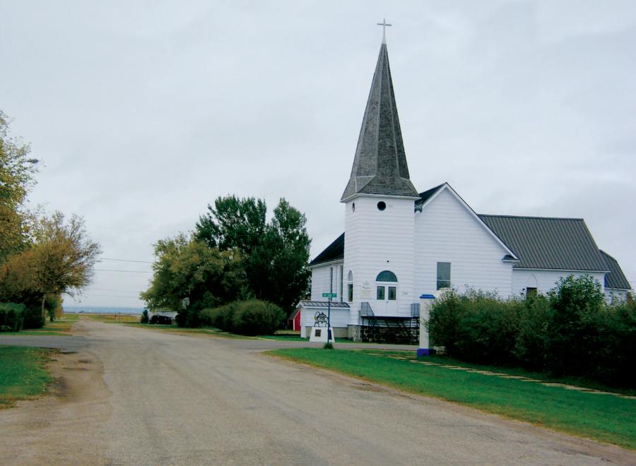 White clapboard church in rural prairie
