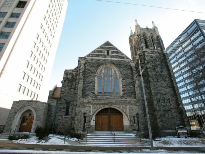 Old church surrounded by skyscrapers