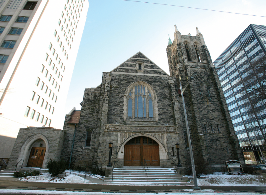 Old church surrounded by skyscrapers