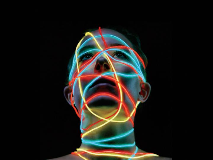Image of woman's head with coloured neural wires