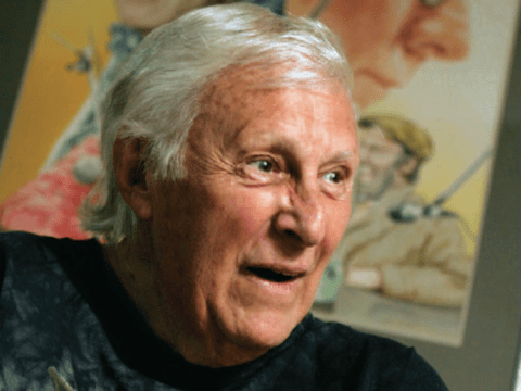 White-haired white man in black shirt