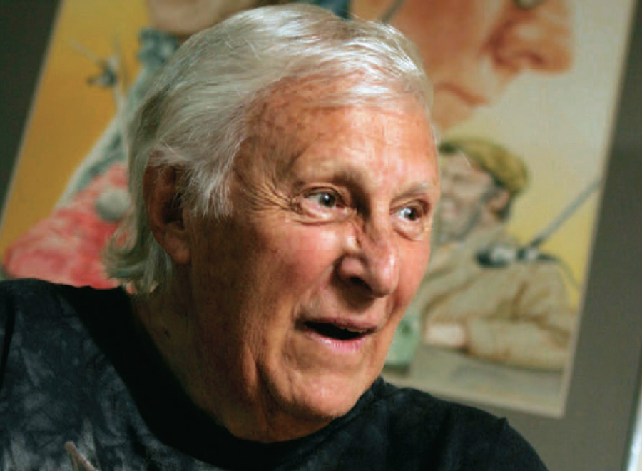 White-haired white man in black shirt