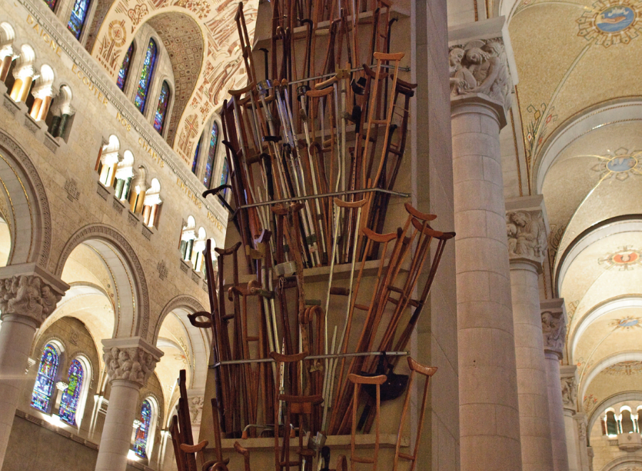 Crutches abandoned in a church and fixed to the pillar