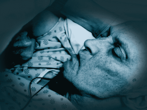 Frail person in hospital bed