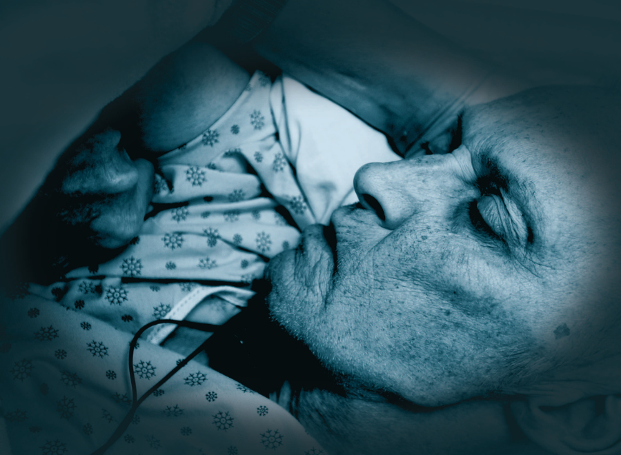 Frail person in hospital bed
