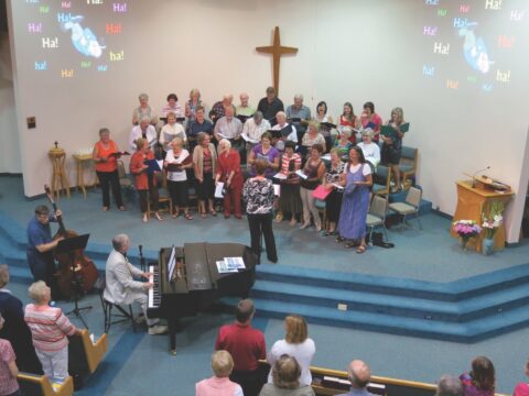 Congregation at service, with piano