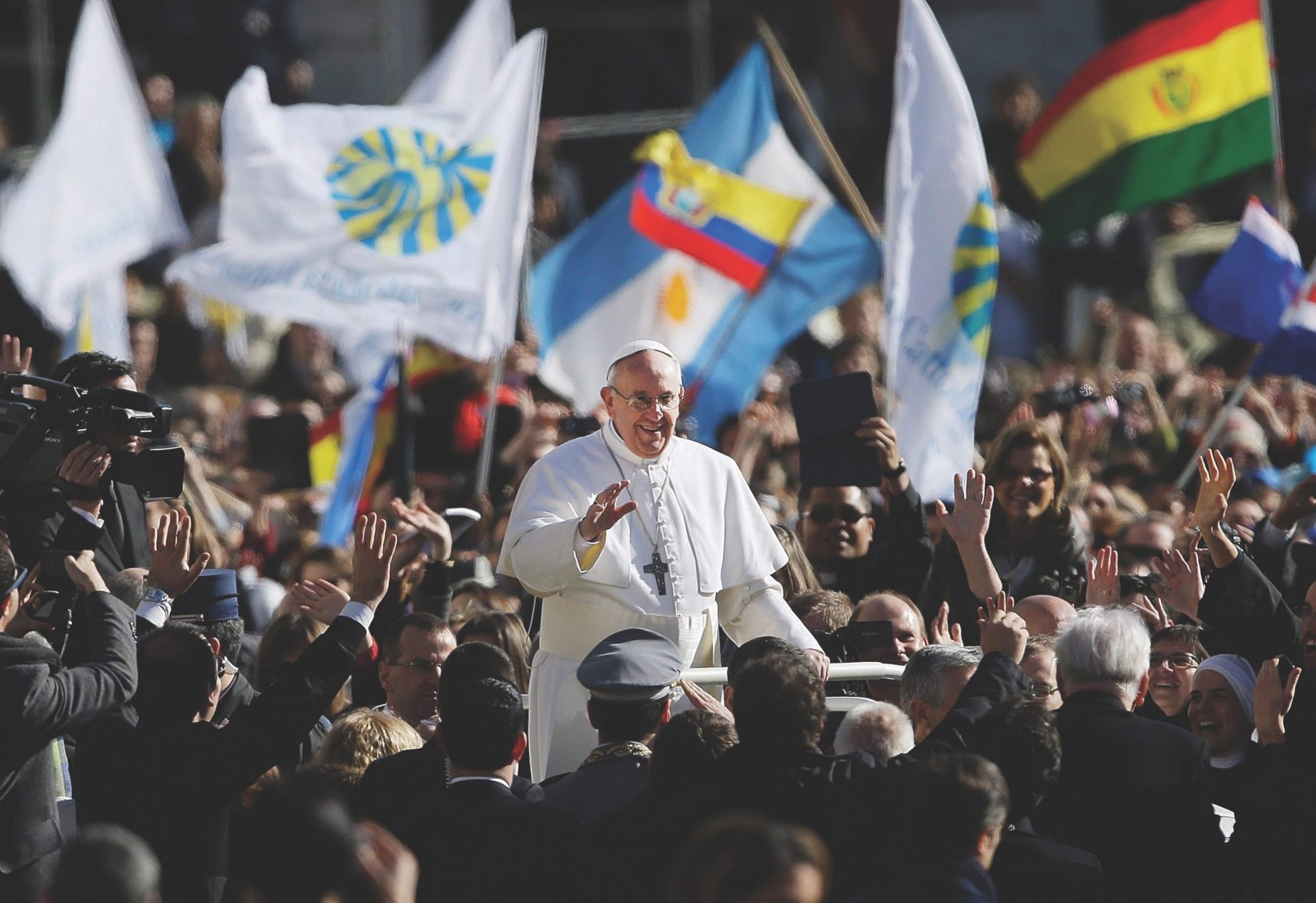 Pope Francis surrounded by crowds