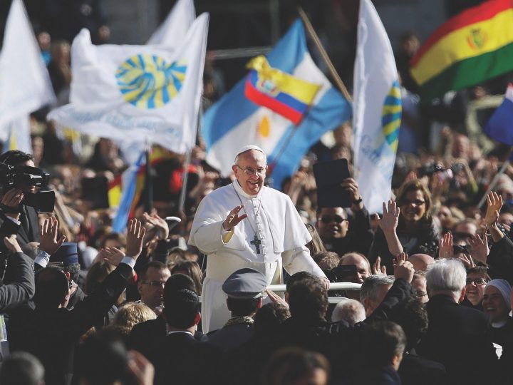 Pope Francis surrounded by crowds