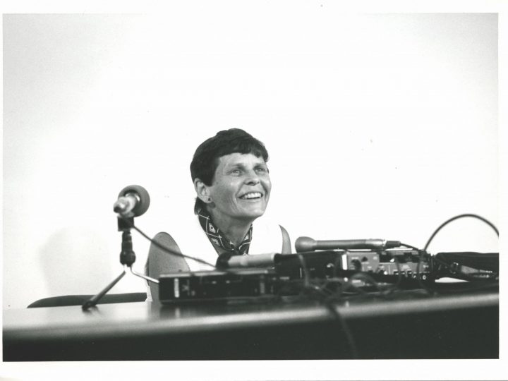 historic photo of woman at mic