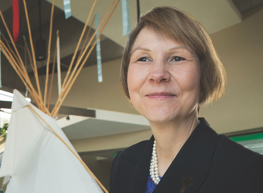 woman standing in front of a teepee