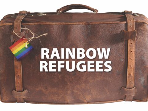 leather suitcase with rainbow refugees label