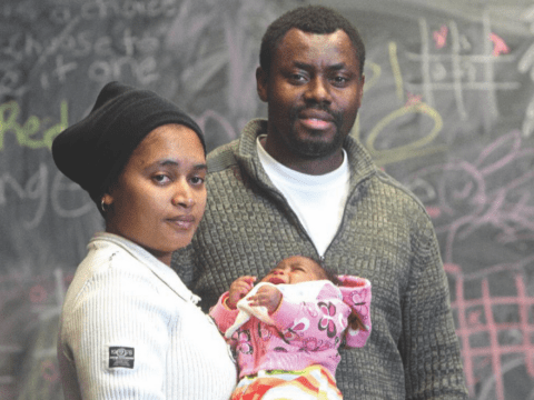 couple holding baby