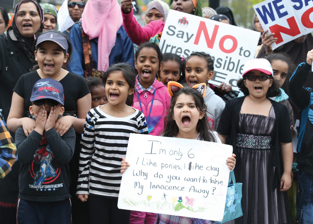 Children and their parents protest Ontario’s new sex-ed curriculum at Queen’s Park in Toronto last May. Photo by Vince Talotta/Toronto Star via Getty Images