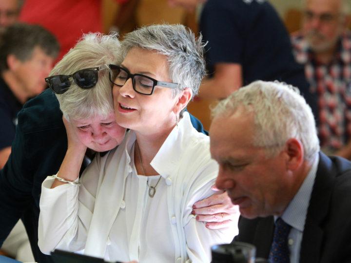 Atheist minister Gretta Vosper receives a hug from Fran Ota, also a United Church minister, before the start of the Toronto Conference Sub-Executive meeting, held on Sept. 15. The Sub-Executive will meet again on Sept. 19 to decide whether or not to ask the church's General Council to call a formal hearing to consider placing Vosper on the Discontinued Service List (Disciplinary). Photo by Hugh Wesley