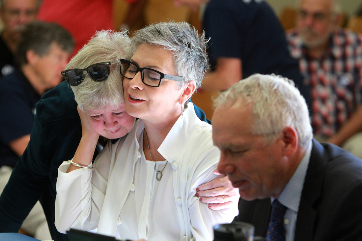 Atheist minister Gretta Vosper receives a hug from Fran Ota, also a United Church minister, before the start of the Toronto Conference Sub-Executive meeting, held on Sept. 15. The Sub-Executive will meet again on Sept. 19 to decide whether or not to ask the church's General Council to call a formal hearing to consider placing Vosper on the Discontinued Service List (Disciplinary). Photo by Hugh Wesley