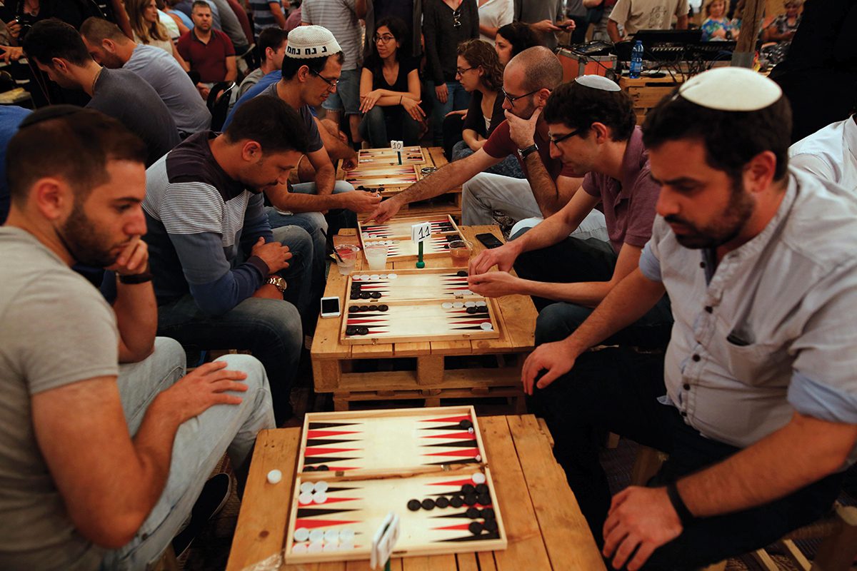 Palestinians and Israelis compete in a backgammon tournament in Jerusalem last August. Photo by GIL COHEN-MAGEN/AFP/Getty Images