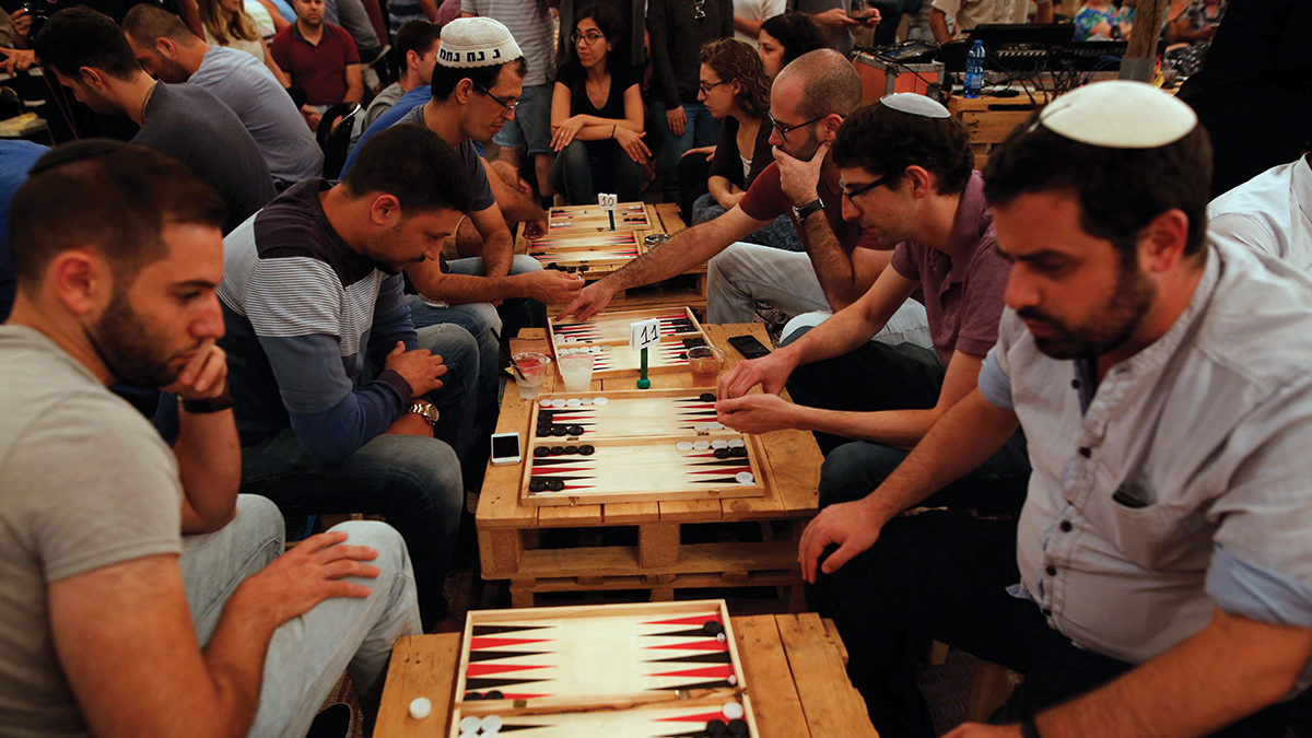 Palestinians and Israelis compete in a backgammon tournament in Jerusalem last August. Photo by GIL COHEN-MAGEN/AFP/Getty Images