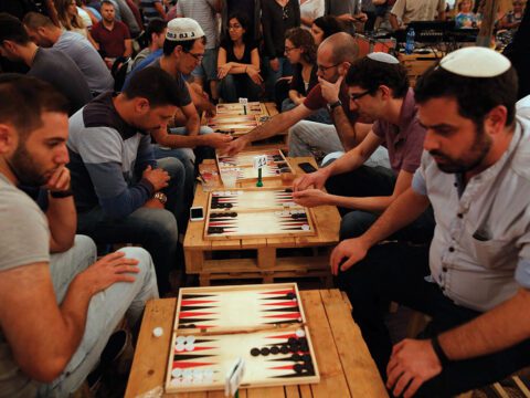 Palestinians and Israelis compete in a backgammon tournament in Jerusalem last August. Photo by GIL COHEN-MAGEN/AFP/Getty Images