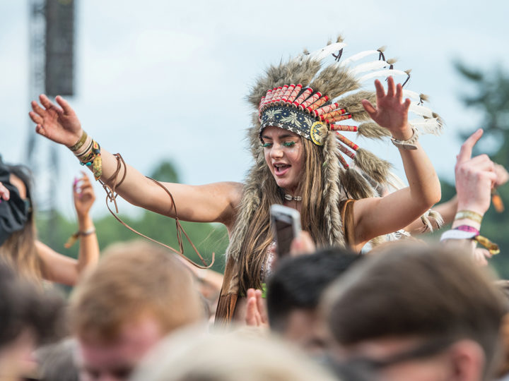 A music festival reveller in 2015. Several music festivals have now banned headdresses. Photo by Ollie Millington/WireImage/Getty Images