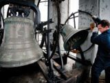 Bell repairer Daniel Désormiers examines the clapper on one of the bells at Notre-Dame-des-Sept-Douleurs in Montreal in 2011. Photo by Peter McCabe
