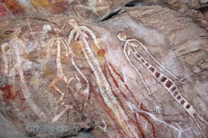 Mimih or spirit figures, at the Nanguluwur site in Kakadu National Park. The figure on the left with four arms is Algaihgo, the fire woman, one of the ancestors who created the world. Photo by age fotostock/Alamy Stock Photo