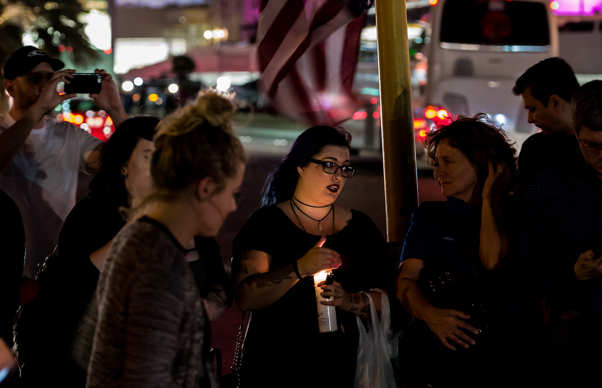 Mourners light candles and leave flowers at the Route 91 Harvest Festival shooting victims memorial in Las Vegas, on Oct. 6, 2017. Photo by Gian Sapienza/iStock