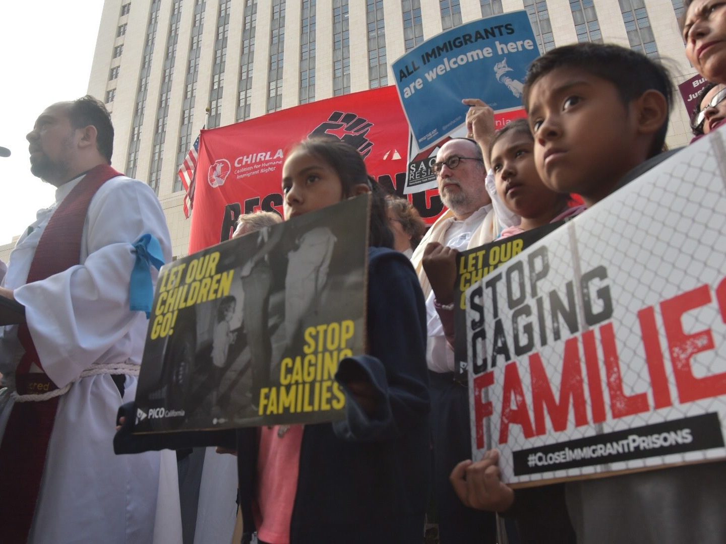 Protesters in Los Angeles demonstrate in June against Attorney General Jeff Sessions, denouncing his defence of the “zero-tolerance” border policy. (Credit: Francisco Lozano/CrowdSpark/The Canadian Press)