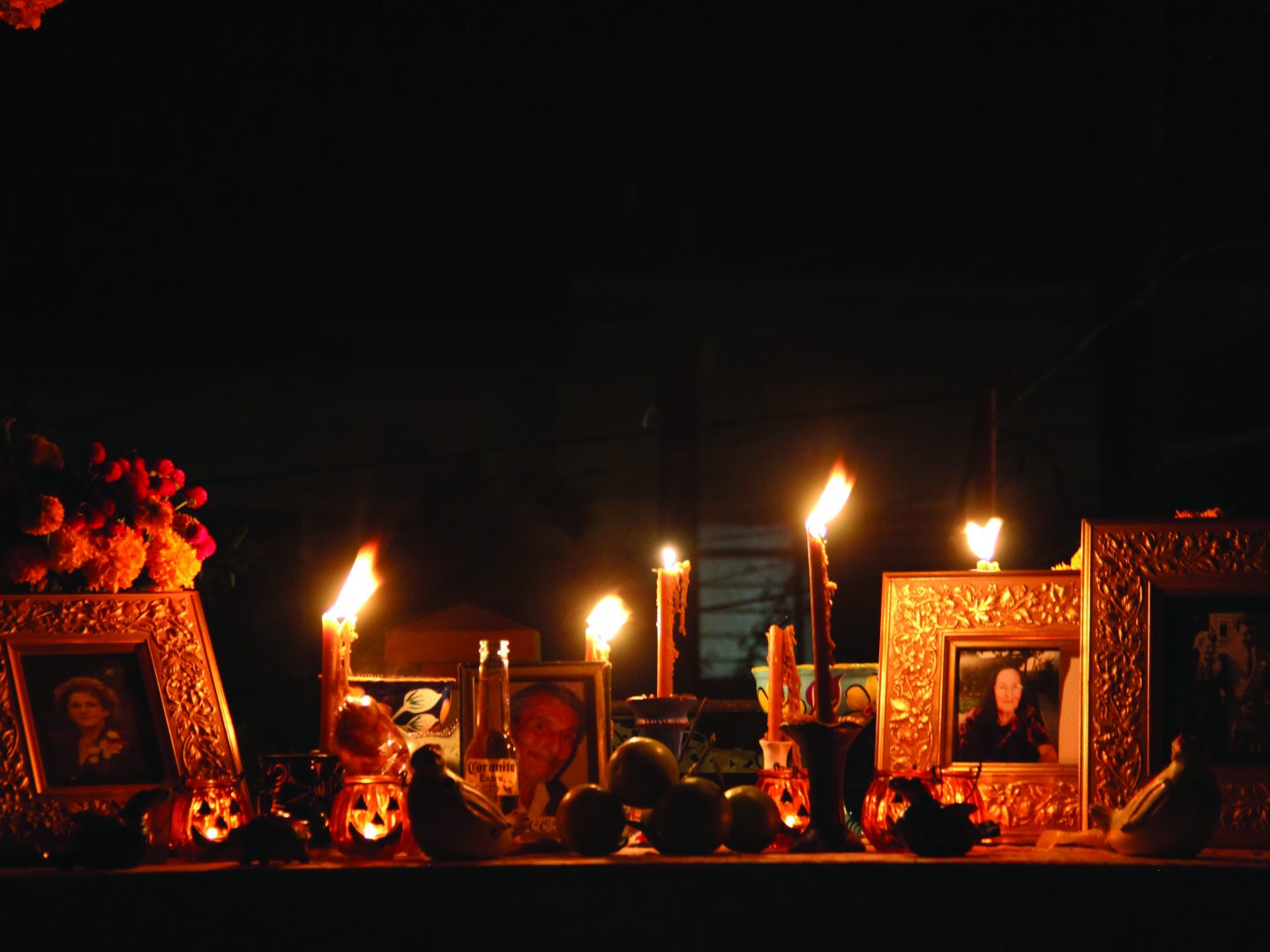 The altar that writer Nancy Fornasiero built with family and friends includes a photo of her mom (far left). (Photo: Nancy Fornasiero)