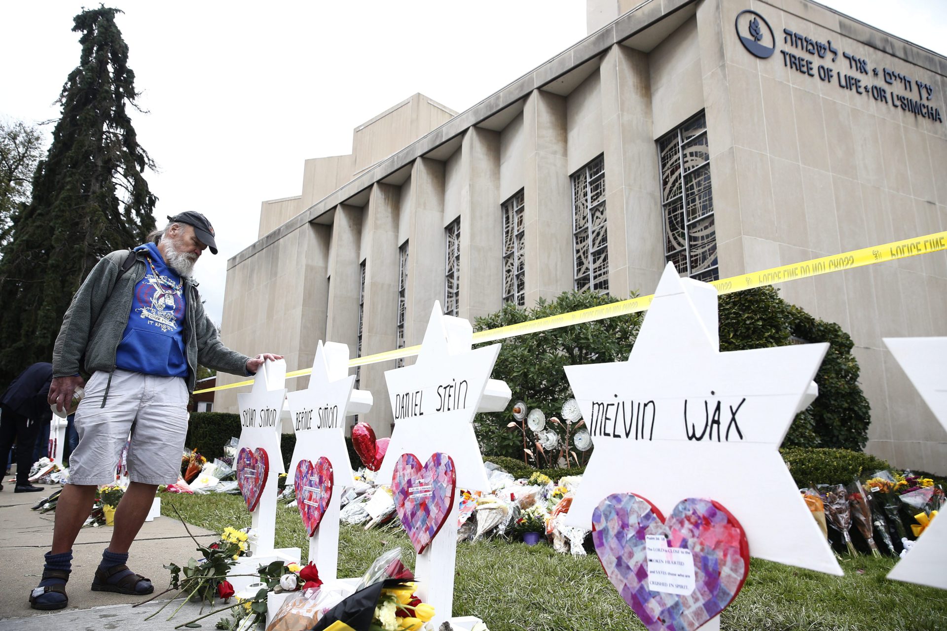 A man takes a moment at each of the Star of David memorials with the names of the 11 people who were killed at the Tree of Life synagogue two days after a mass shooting in Pittsburgh, Pa., on Oct. 29, 2018. (Credit: Jared Wickerham/EPA)