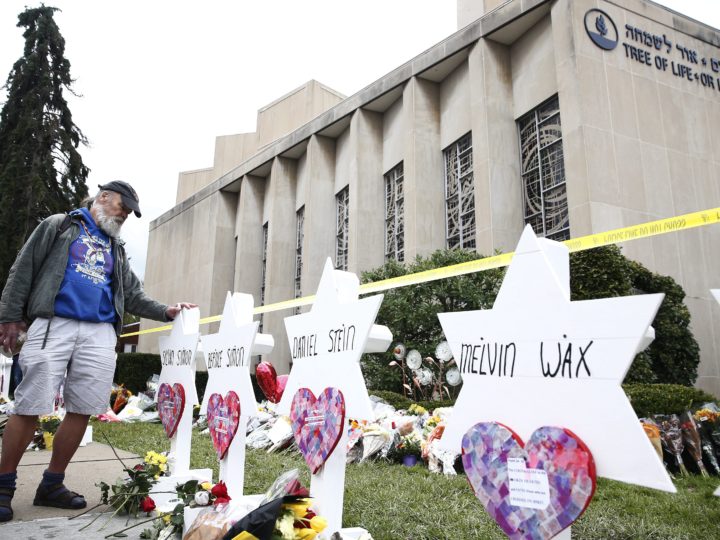 A man takes a moment at each of the Star of David memorials with the names of the 11 people who were killed at the Tree of Life synagogue two days after a mass shooting in Pittsburgh, Pa., on Oct. 29, 2018. (Credit: Jared Wickerham/EPA)