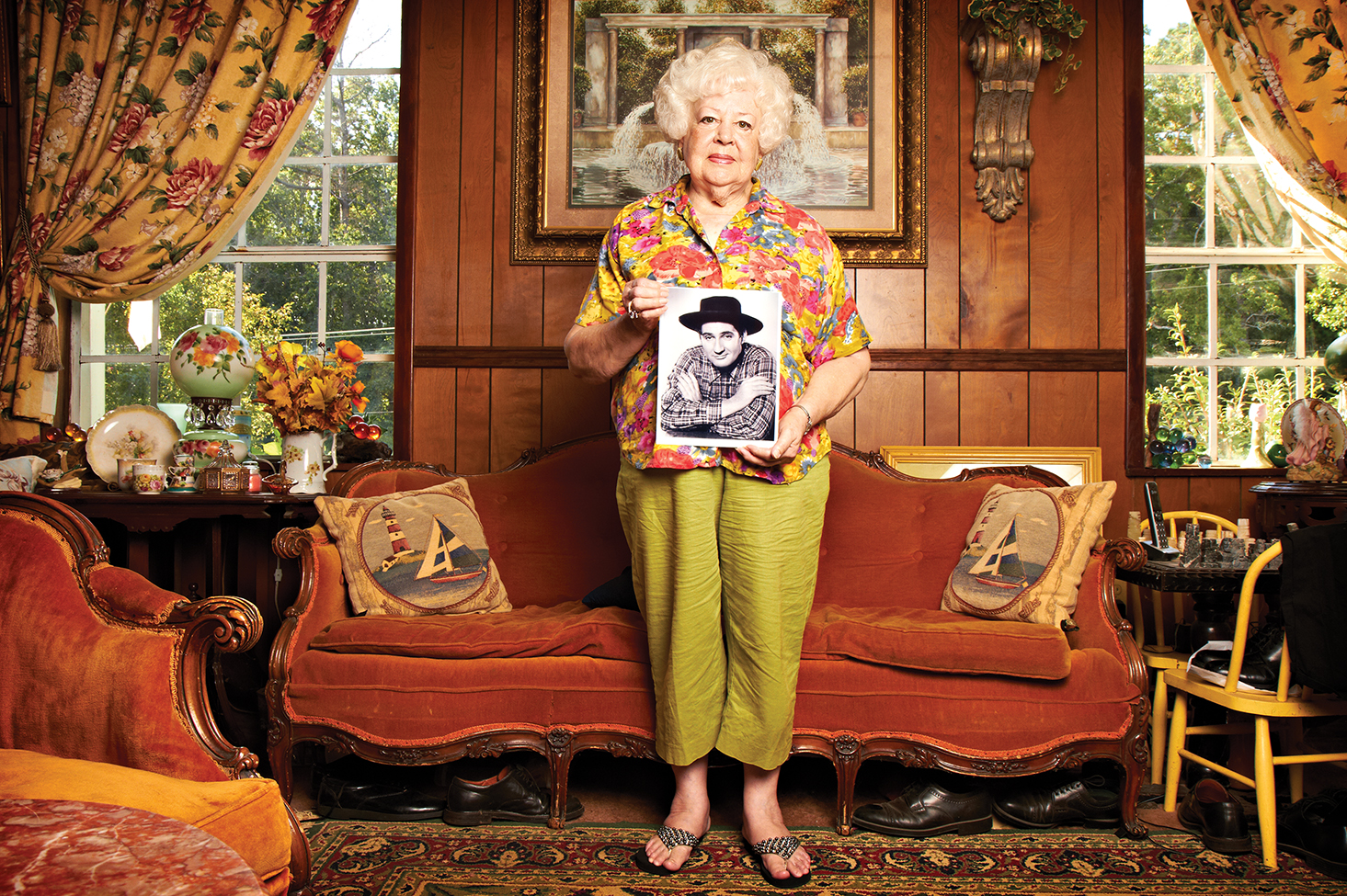 Collector Shirley Sudduth holds a photo of Winston County native Pat Buttram, who played Mr. Haney in the 1960s TV comedy "Green Acres." Photo by Nigel Dickson