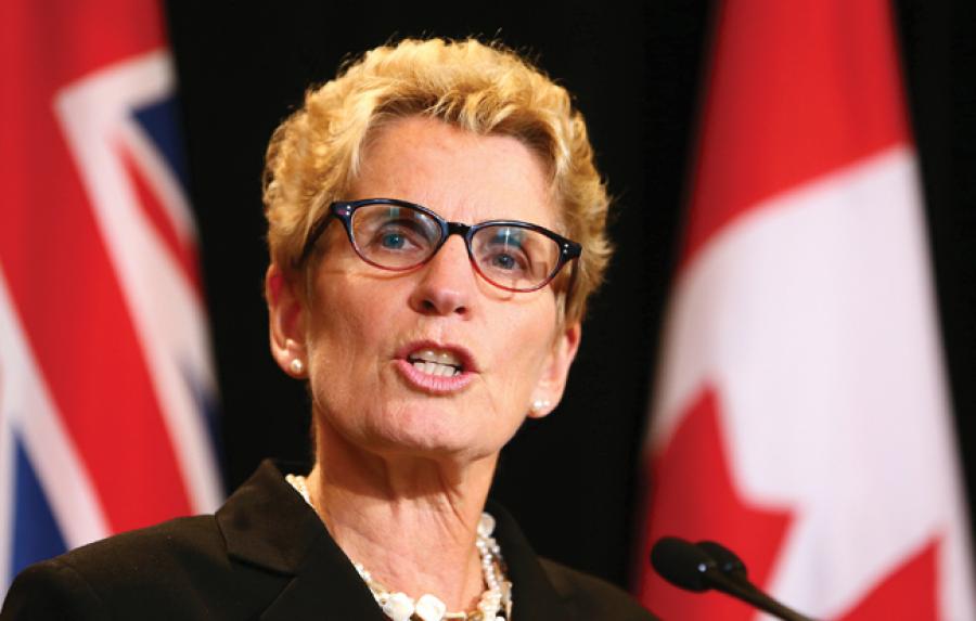 Ontario Premier Kathleen Wynne speaks at Queen's Park in Toronto in 2013. Photo by Dave Abel/Toronto Sun/QMI Agency