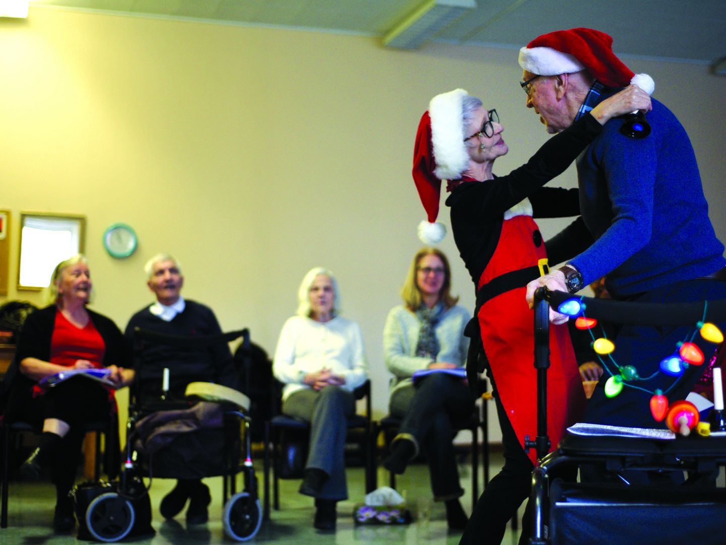 Moe Archambault, a leader of the Turquoise music program, dances with Bob Pope, a participant. (Photo by Cynthia Munster)