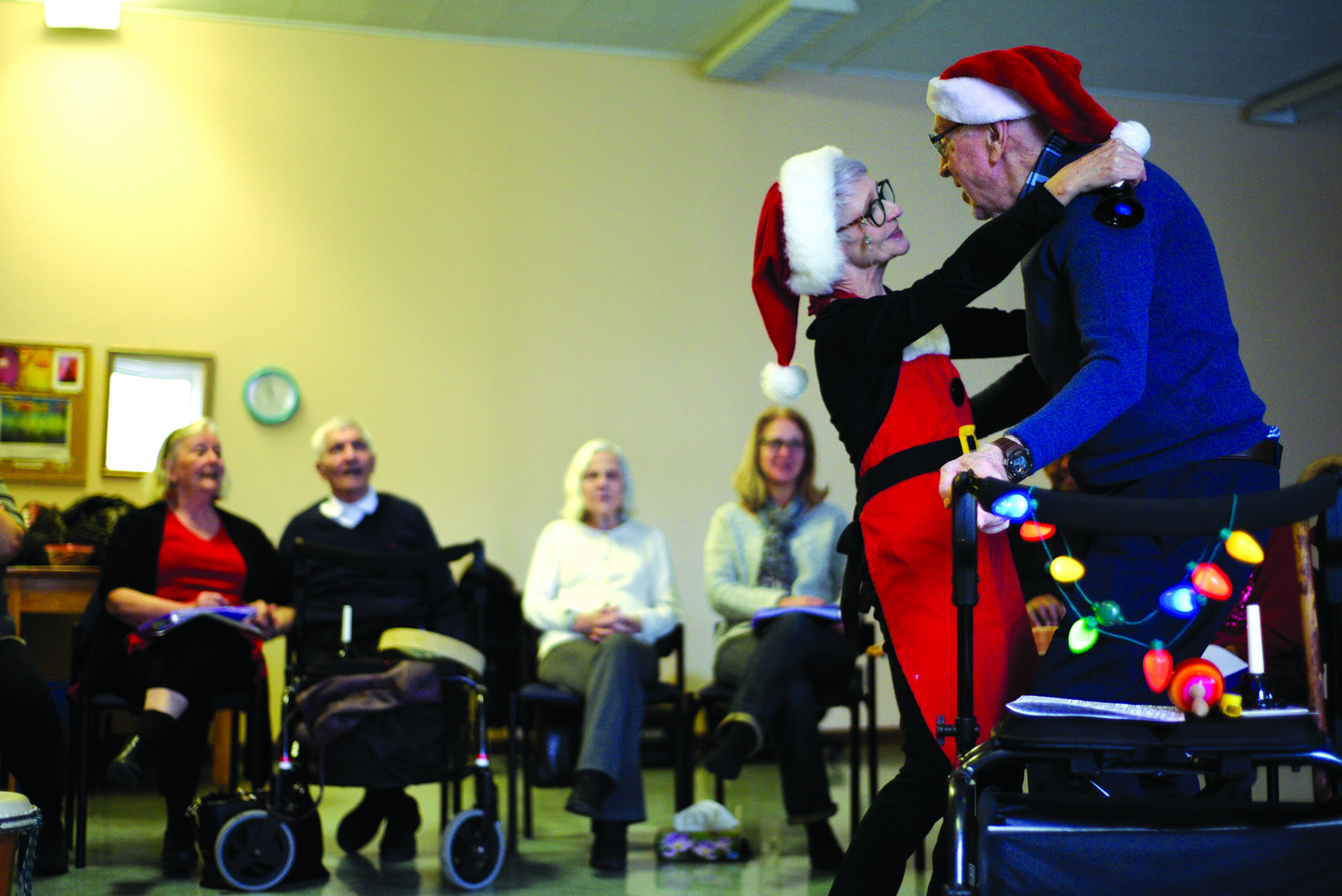 Moe Archambault, a leader of the Turquoise music program, dances with Bob Pope, a participant. (Photo by Cynthia Munster)
