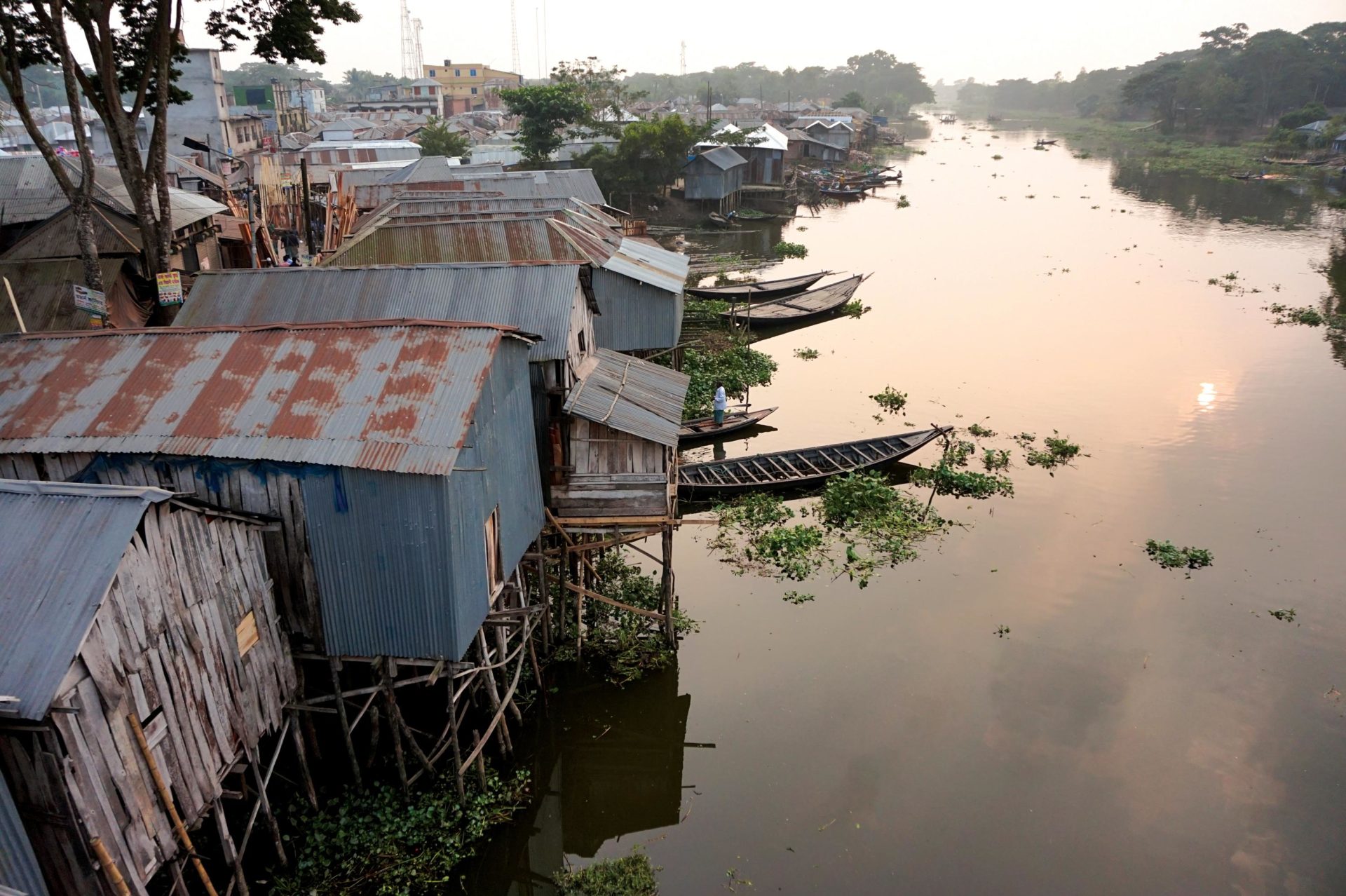 Riverside houses in Kotalipara, Bangladesh, are built on stilts to keep them out of reach of monsoon flooding. Photo by Josiah Neufeld
