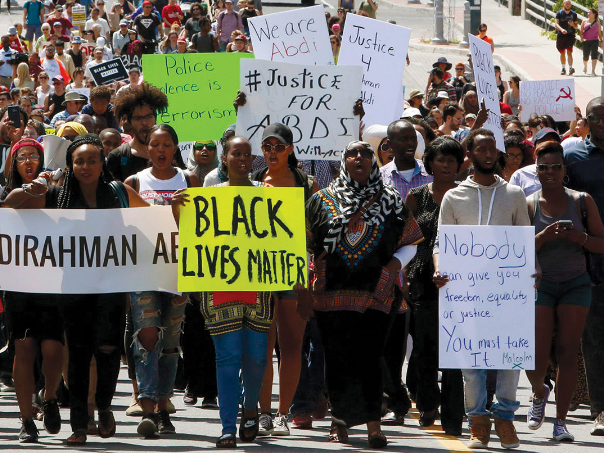 Hundreds march on July 30 to honour Abdirahman Abdi and protest his death. Abdi died following a confrontation with Ottawa police officers. Photo by Fred Chartrand/The Canadian Press