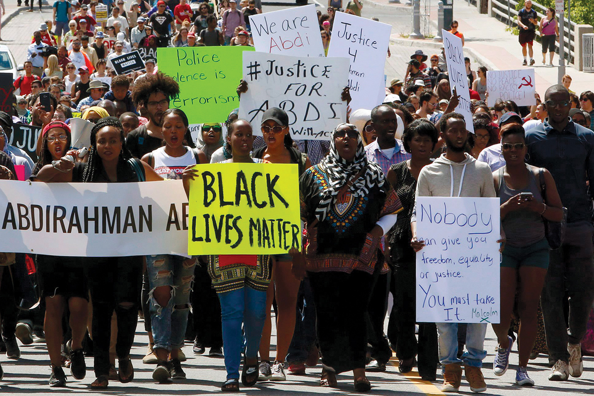 Hundreds march on July 30 to honour Abdirahman Abdi and protest his death. Abdi died following a confrontation with Ottawa police officers. Photo by Fred Chartrand/The Canadian Press