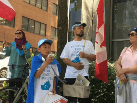 Bakhtiar (right) and his 11-year-old son protesting in Montreal.