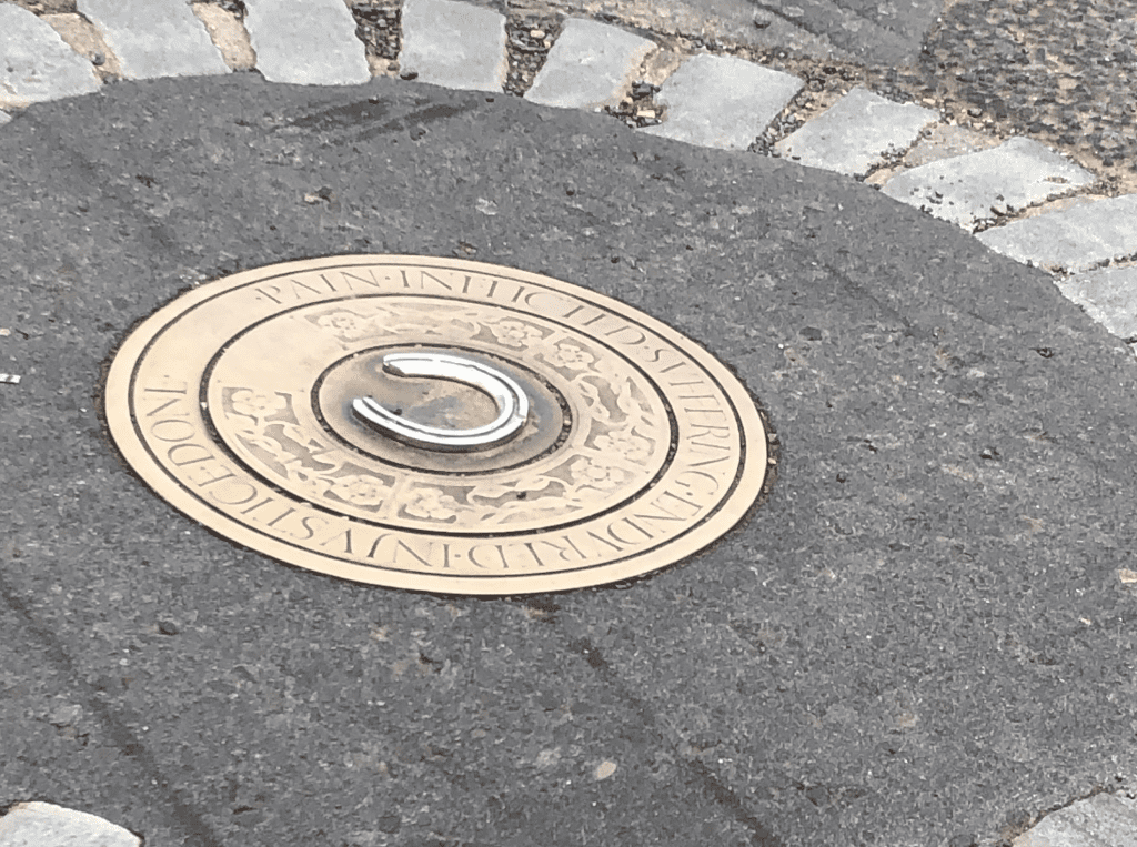 A plaque marks where the remains of seven so-called witches were buried. (Photo: Sarah Ratchford)